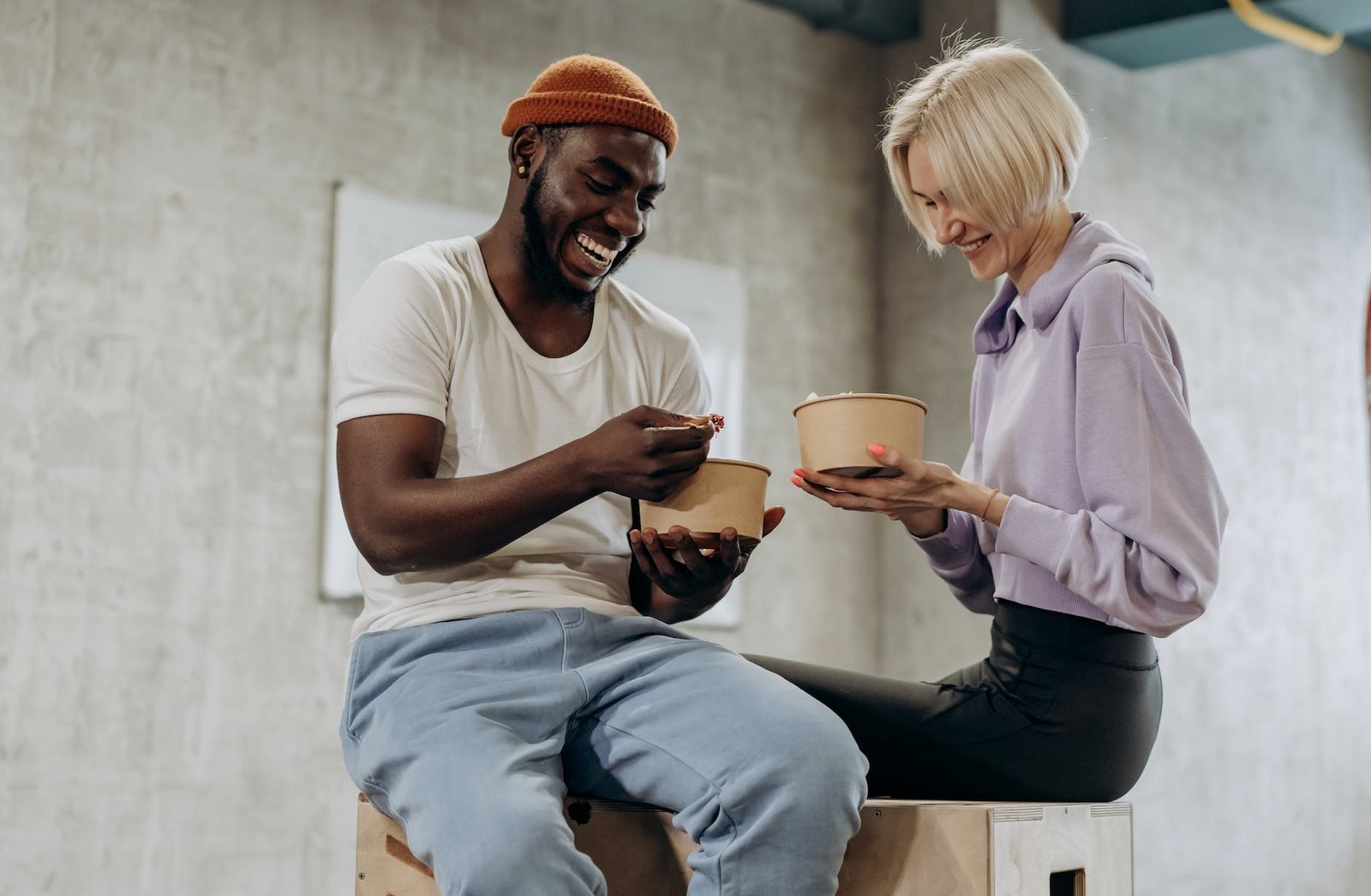 man and woman eating together